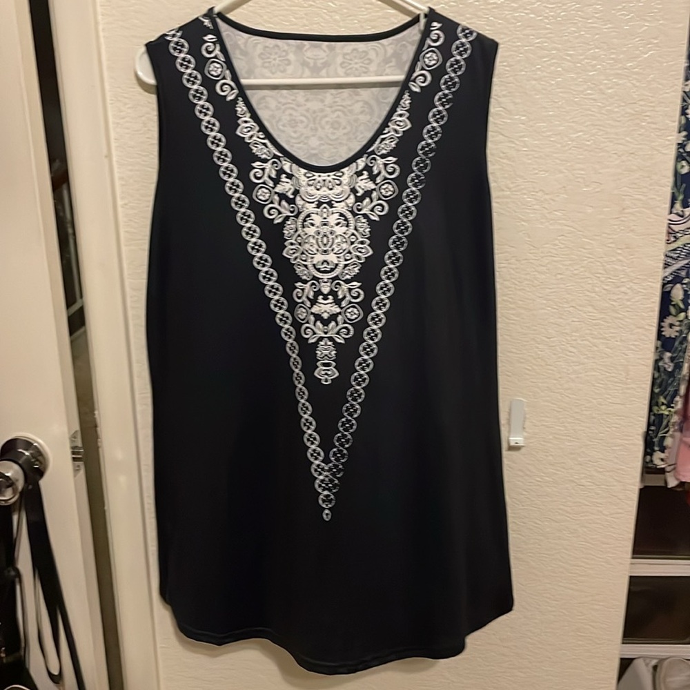 Black and white sleeveless top.